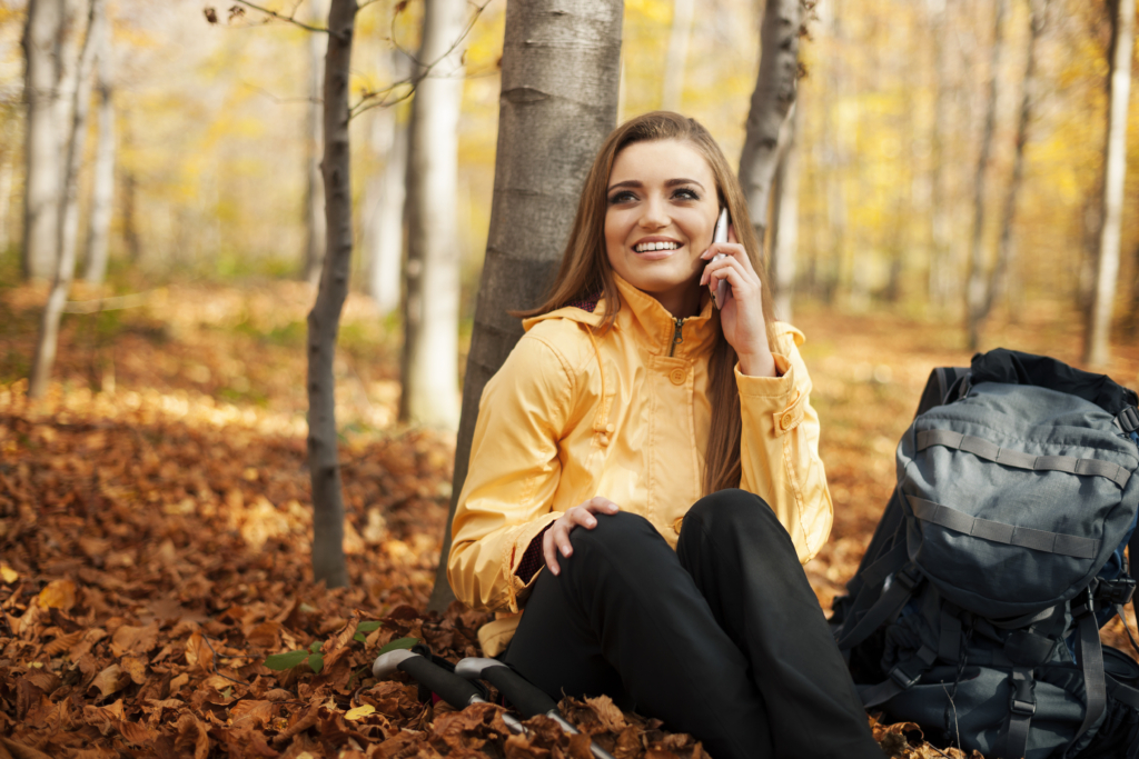 hiker woman resting talking mobile phone