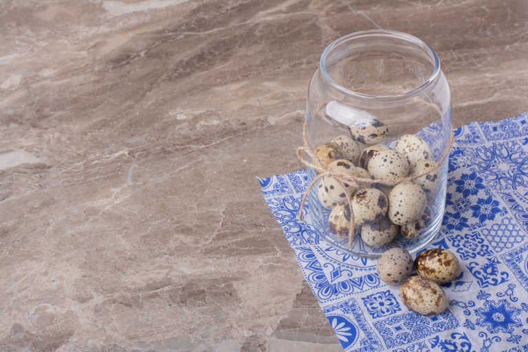 quail eggs glass container marble